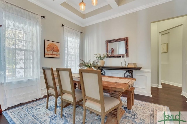 living area featuring dark hardwood / wood-style flooring, coffered ceiling, and ornamental molding