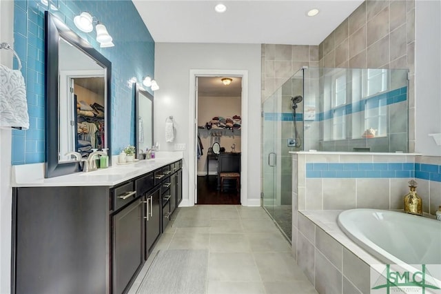 bathroom with vanity, separate shower and tub, and tile patterned flooring