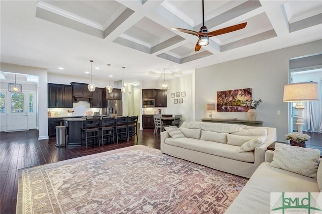 living room with beamed ceiling, ceiling fan, coffered ceiling, and dark hardwood / wood-style floors