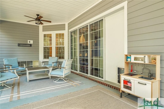 exterior space featuring sink and ceiling fan