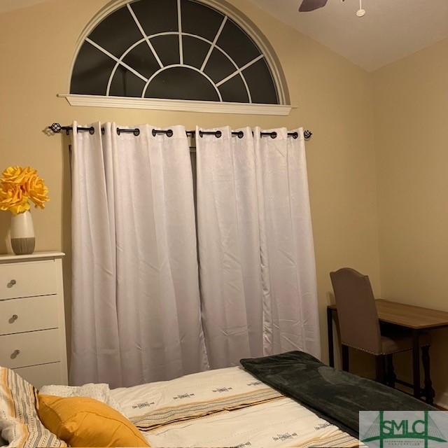 bathroom featuring lofted ceiling and ceiling fan