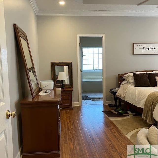 bedroom featuring ornamental molding and dark hardwood / wood-style floors