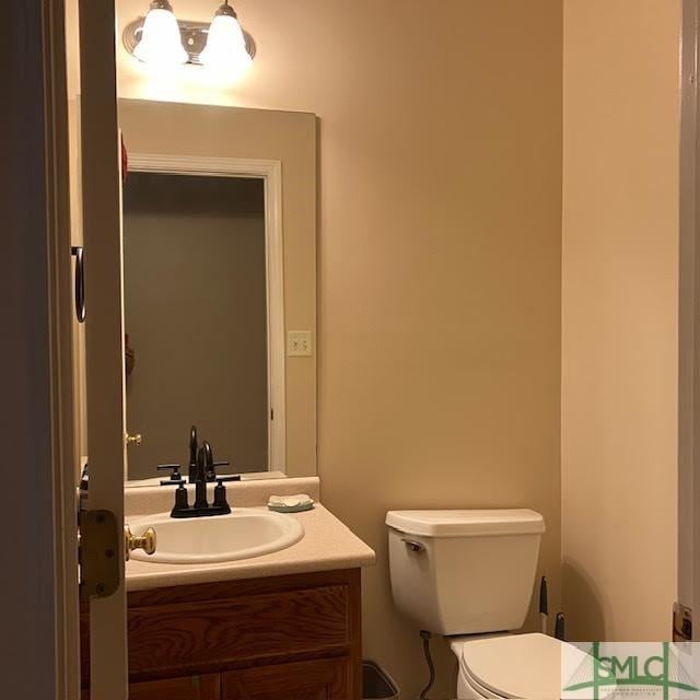 bathroom with vanity and toilet