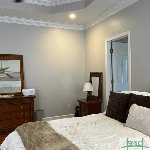 bedroom with ornamental molding