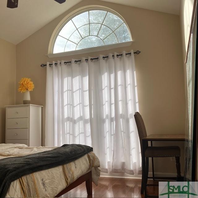 bedroom featuring vaulted ceiling