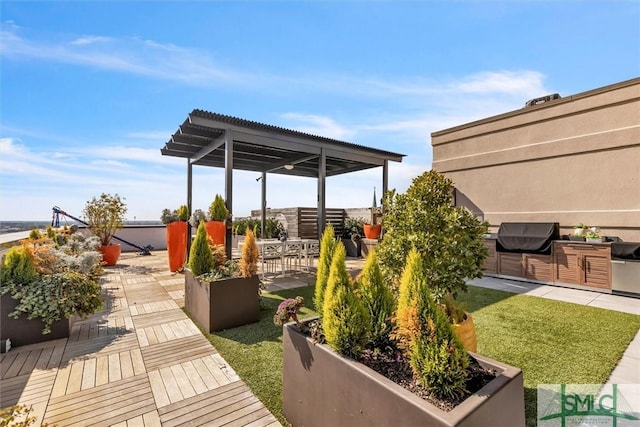 view of patio / terrace featuring a grill and an outdoor kitchen