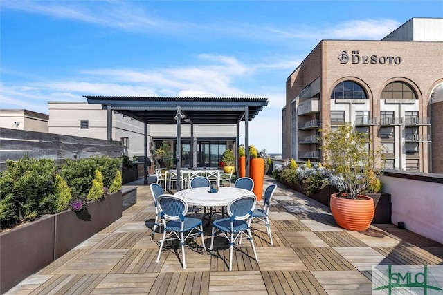 deck with outdoor dining area