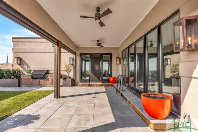 view of patio featuring a ceiling fan