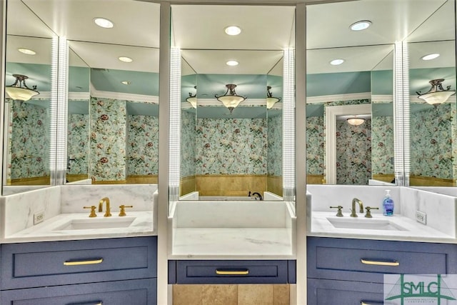 bathroom featuring a sink, backsplash, and two vanities