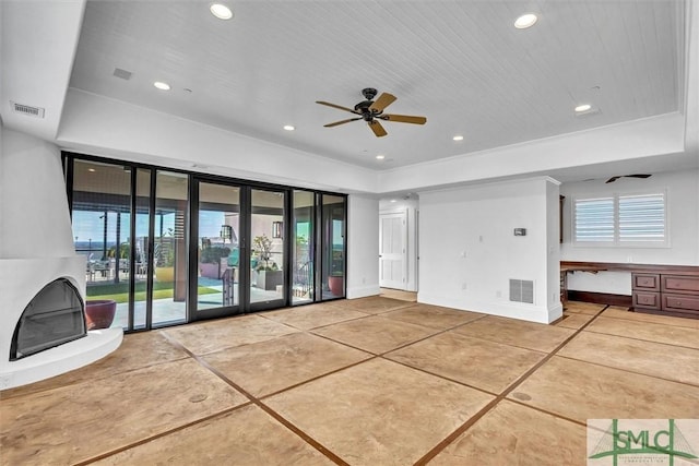 interior space with recessed lighting, visible vents, baseboards, and built in study area