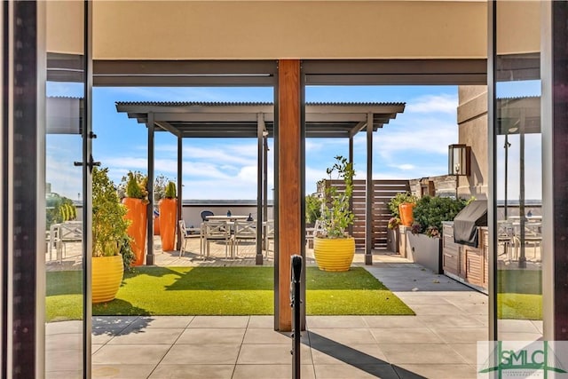 doorway to outside featuring tile patterned flooring