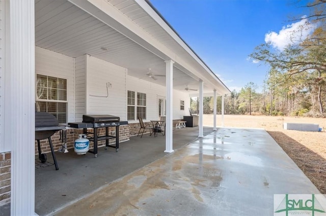 view of patio / terrace featuring ceiling fan and a grill