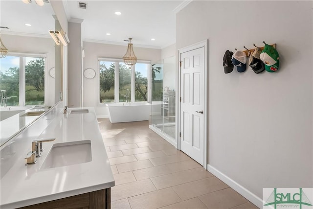 bathroom with vanity, crown molding, tile patterned floors, and separate shower and tub