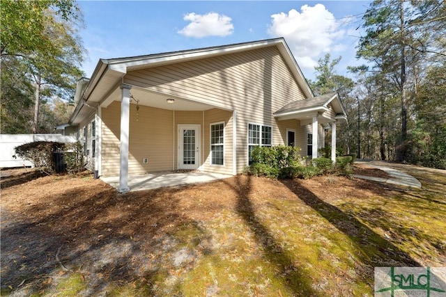 back of property featuring a patio