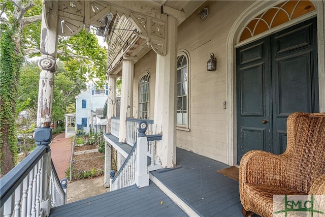 wooden deck featuring covered porch