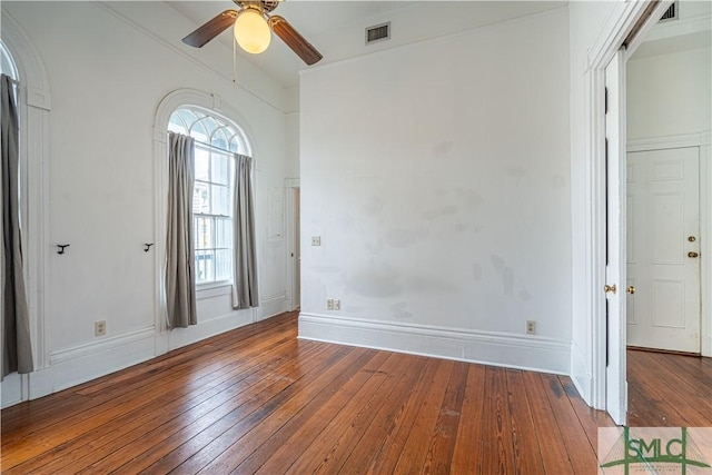 spare room with hardwood / wood-style flooring and ceiling fan