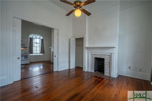 unfurnished living room with dark hardwood / wood-style floors and ceiling fan