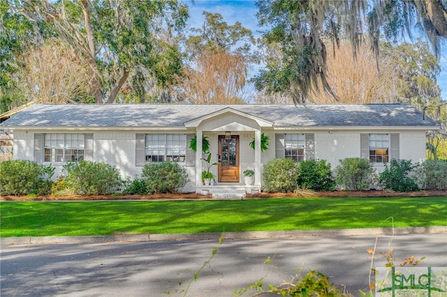 ranch-style house with a front yard