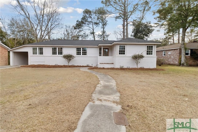 ranch-style home featuring a front yard and a carport