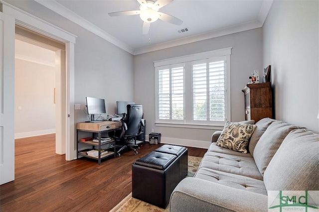 office featuring ceiling fan, ornamental molding, and dark hardwood / wood-style floors