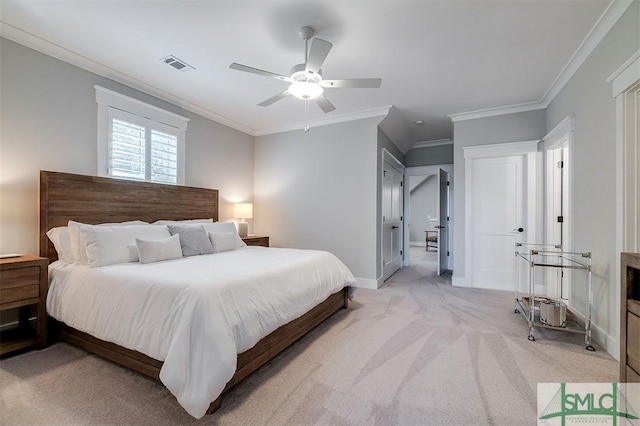 carpeted bedroom with ornamental molding and ceiling fan