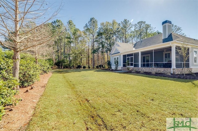 view of yard with a sunroom