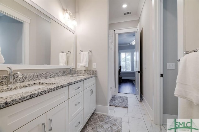 bathroom featuring vanity and crown molding