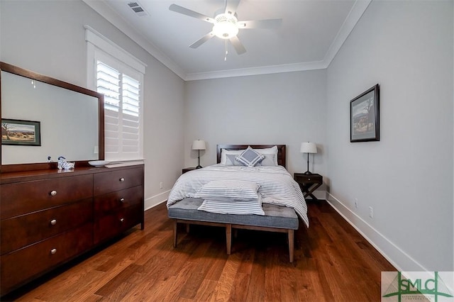 bedroom with crown molding, ceiling fan, and dark wood-type flooring