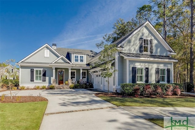 view of front facade with a garage and a front yard