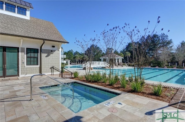 view of pool with a gazebo, a patio, and a community hot tub