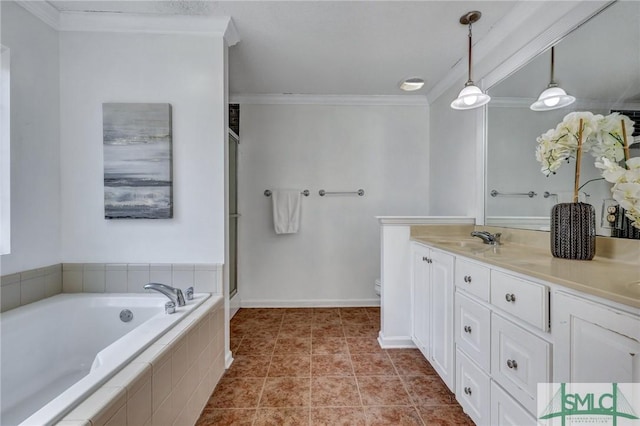 bathroom featuring tile patterned flooring, vanity, ornamental molding, tiled bath, and toilet