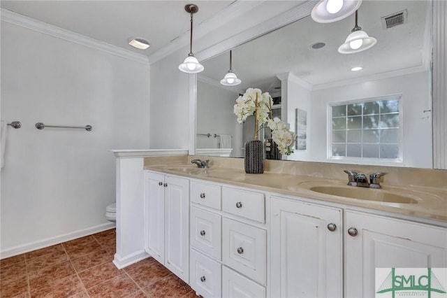 bathroom featuring tile patterned flooring, ornamental molding, vanity, and toilet