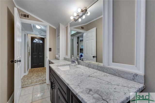 bathroom featuring vanity, tile patterned flooring, and ornamental molding