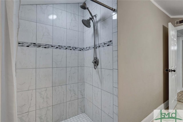 bathroom with curtained shower and ornamental molding