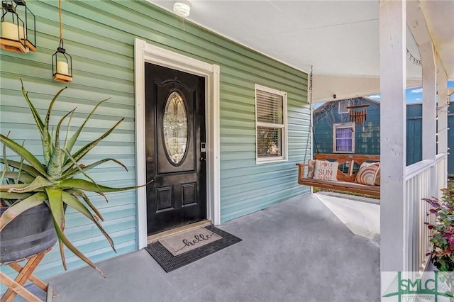 entrance to property with covered porch