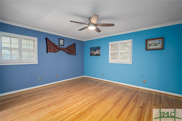 spare room with ceiling fan, ornamental molding, and light hardwood / wood-style floors