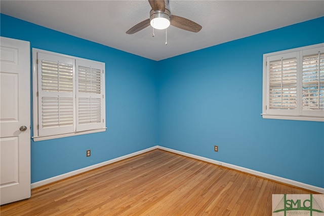 unfurnished room featuring ceiling fan and light hardwood / wood-style flooring