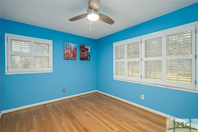 unfurnished room with wood-type flooring and ceiling fan