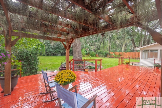 wooden terrace with a pergola and a yard