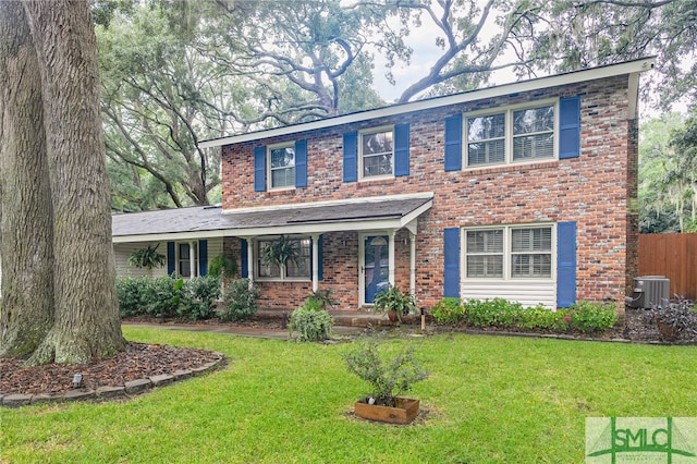 view of front of house featuring a front yard, covered porch, and cooling unit