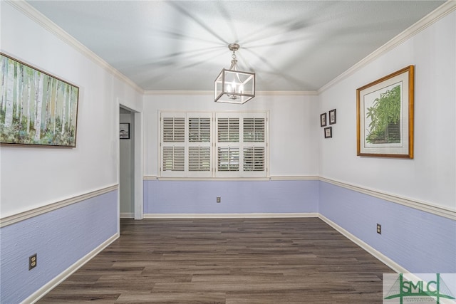 unfurnished dining area with crown molding, dark hardwood / wood-style flooring, and an inviting chandelier