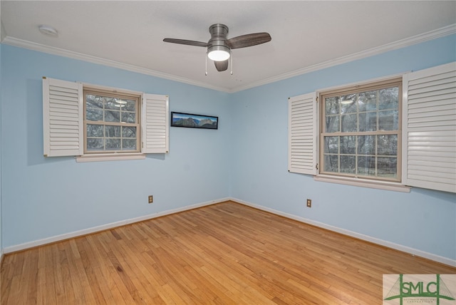 spare room with crown molding, ceiling fan, and light hardwood / wood-style flooring