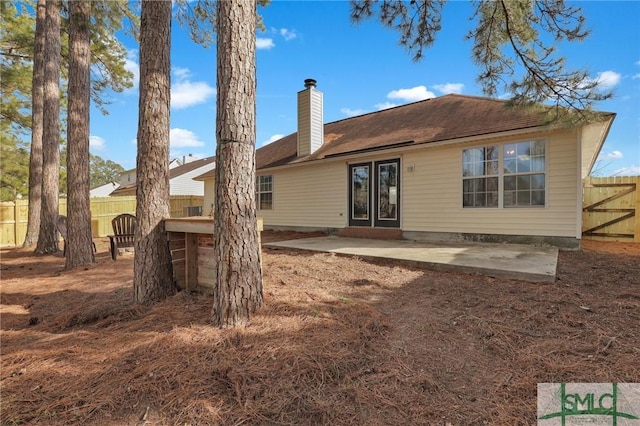 back of house with a patio area