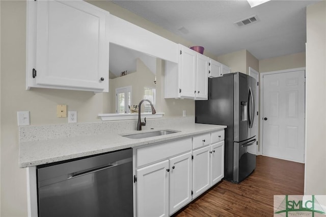 kitchen with stainless steel refrigerator with ice dispenser, sink, white cabinetry, light stone counters, and dishwashing machine