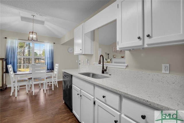 kitchen featuring white cabinetry, black dishwasher, sink, and light stone countertops