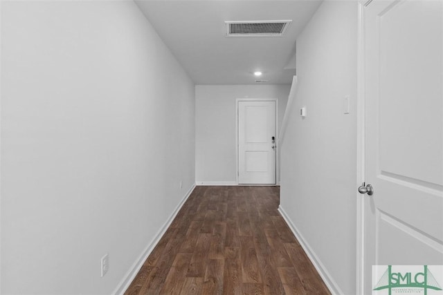 corridor featuring dark wood-type flooring