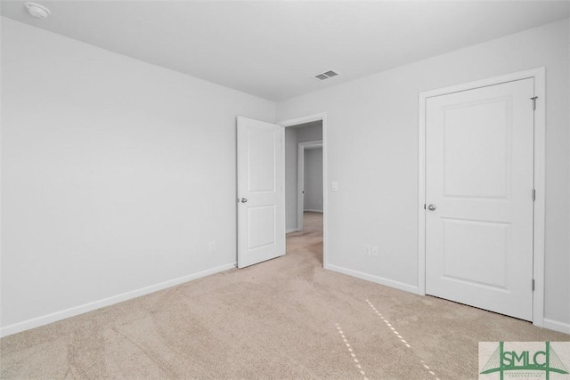 unfurnished bedroom with light carpet