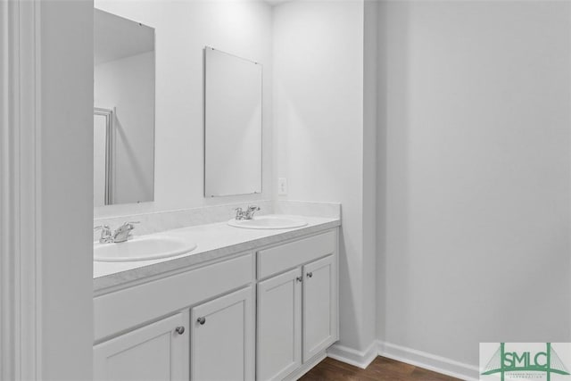 bathroom featuring vanity and hardwood / wood-style flooring