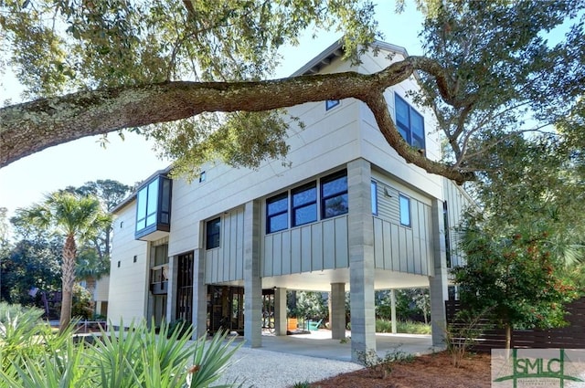 back of property with a carport