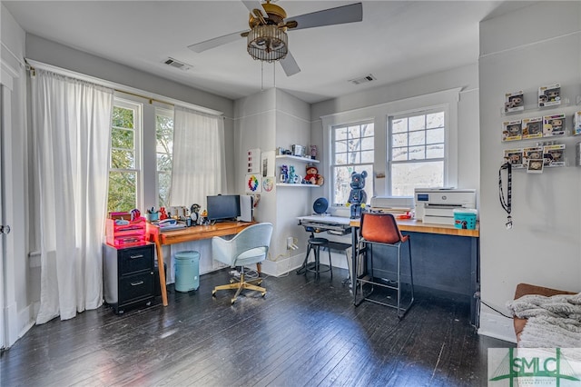 office area with a healthy amount of sunlight, dark wood-type flooring, and ceiling fan